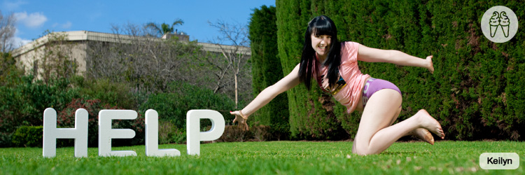 Bending over in the grass in t-shirt and panties.